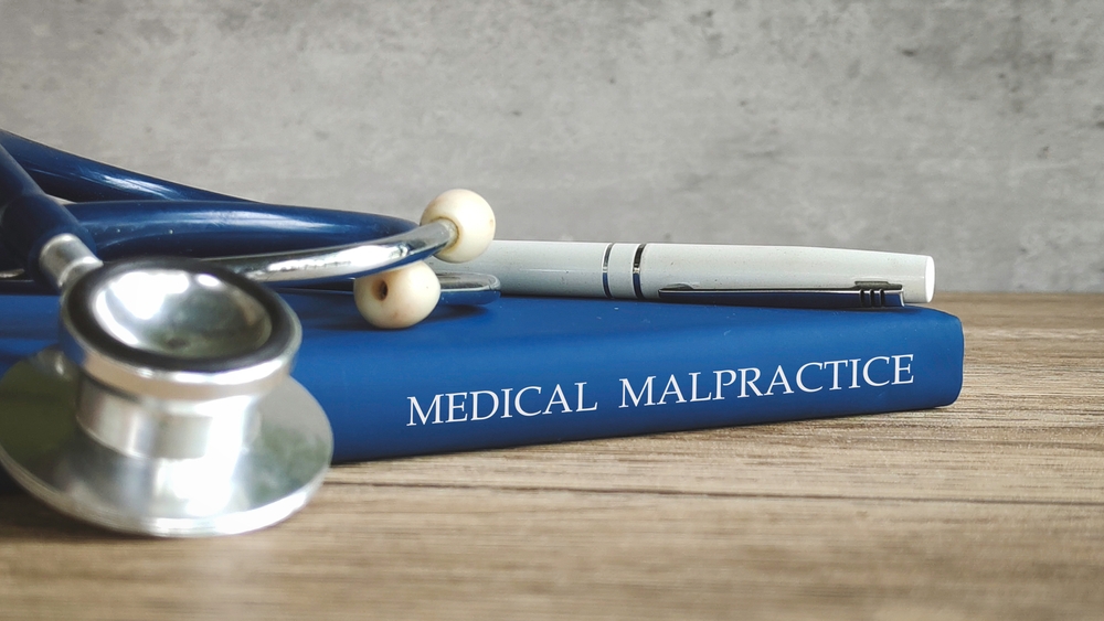 Medical malpractice claim concept showing stethoscope and law book representing New Jersey medical negligence cases
