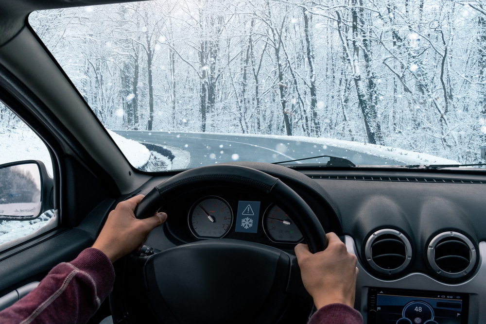 Snowy New Jersey roadway seen from inside a vehicle, showing winter conditions that can lead to motor vehicle injury claims.