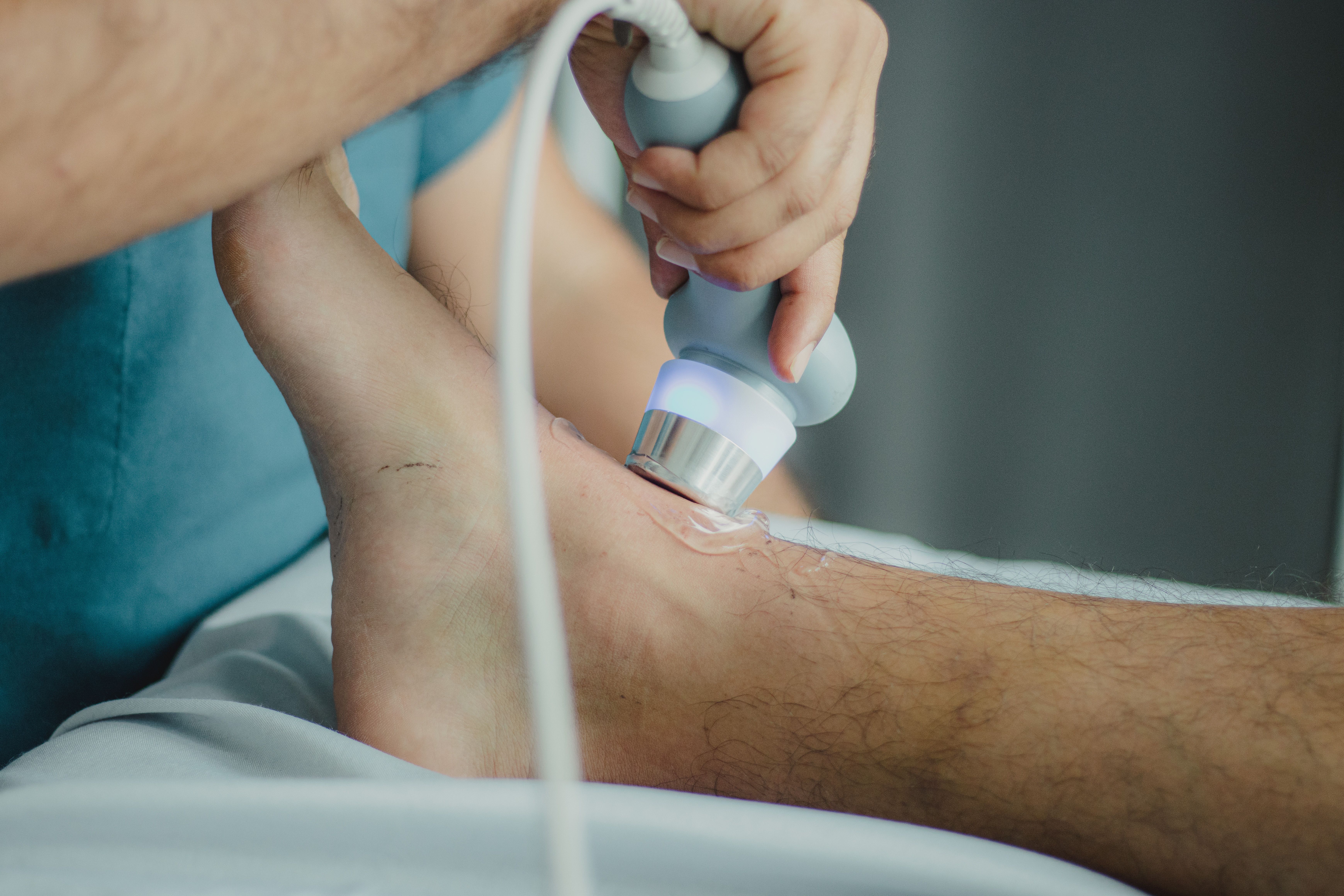 Medical provider uses ultrasound on an ankle to evaluate possible DVT after car accident injuries in New Jersey.
